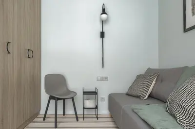 a living room with a gray couch and a chair at IVIS House - Spacious Apartment with Terrace, Vilnius Old Town in Vilnius