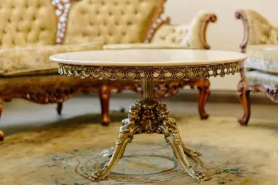 an ornate coffee table in a living room with two chairs at Luxury Old Town Apartment in Kaunas