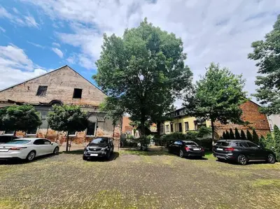 a group of cars parked in front of a house at Luxury Old Town Apartment in Kaunas