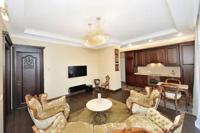 a living room with a table and chairs at Luxury Old Town Apartment in Kaunas