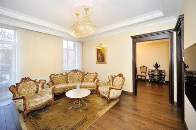 a living room with a couch and chairs and a table at Luxury Old Town Apartment in Kaunas
