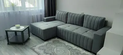a living room with a couch and a table at Pas Olia 2 in Zarasai