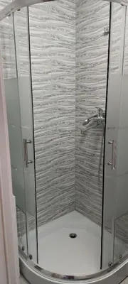 a shower with a glass door in a bathroom at Pas Olia 2 in Zarasai