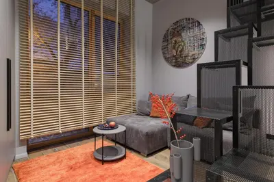 a living room with a couch and a table at IVIS House Modern Apartment in Vilnius Old Town with balcony in Vilnius