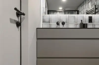 a door to a kitchen with a counter top at IVIS House Modern Apartment in Vilnius Old Town with balcony in Vilnius