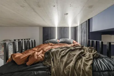 a bedroom with a large bed in a room at IVIS House Modern Apartment in Vilnius Old Town with balcony in Vilnius