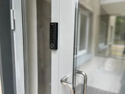 a close up of a glass door with a handle at Luxuria Modern Apartments - Self Check-in in Šiauliai