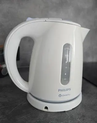 a white tea kettle with a remote control in it at Oldtown Trinity House in Kaunas