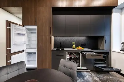 a kitchen with gray cabinets and an open refrigerator at Oldtown Trinity House in Kaunas