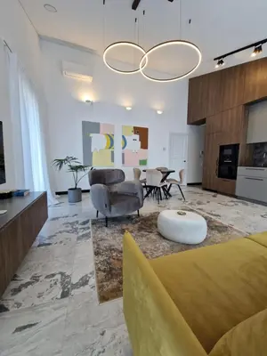 a living room with a couch and a table at Oldtown Trinity House in Kaunas