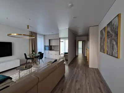 a living room with a couch and a table at Life Story in Kaunas