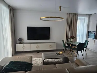 a living room with a couch and a table at Life Story in Kaunas