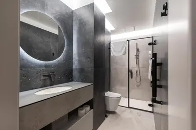 a bathroom with a sink and a toilet and a mirror at Renaissance Key Apartment 29 in Vilnius