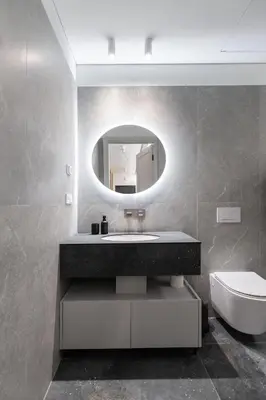 a bathroom with a sink and a mirror at Renaissance Key Apartment 29 in Vilnius