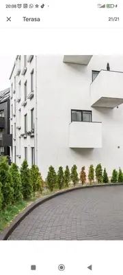 two photographs of a white building and a street at Free Indoor Parking Old Town Basanavičius Park & Balcony in Vilnius