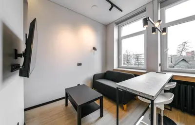 a living room with a couch and a table at Apartments in Vilnius in Vilnius
