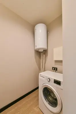 a washer and dryer in a small room at Apartments in Vilnius in Vilnius