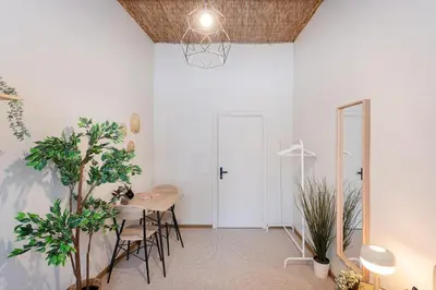 a dining room with a table and chairs at Bali house Vilnius in Vilnius