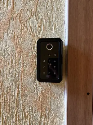 a black electrical outlet on a wall at Topoliai Apartament Self check -in in Panevėžys