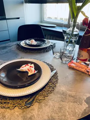 a table with two plates of food on it at Siauliai ‘Four sisters’ in Šiauliai