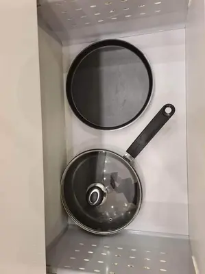 a metal bowl and a mirror on a wall at River view appartment in Kaunas in Kaunas