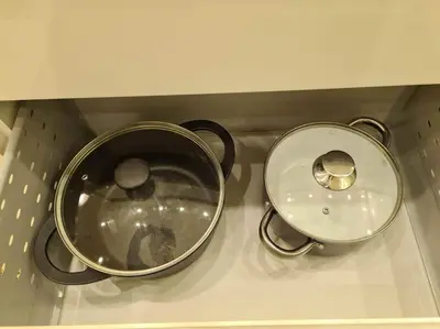 a kitchen counter with a pot and a sink at River view appartment in Kaunas in Kaunas