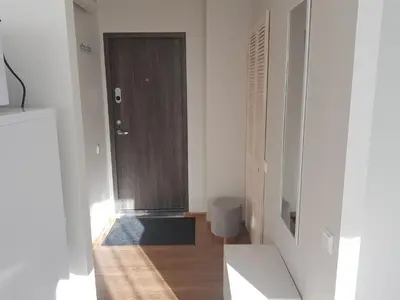 a hallway with a door and a wooden floor at Stay in center #Šiauliai in Šiauliai
