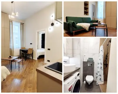 a kitchen and a living room with a green couch at Stylish Central Station Old Town Apart FREE PARKING in Vilnius