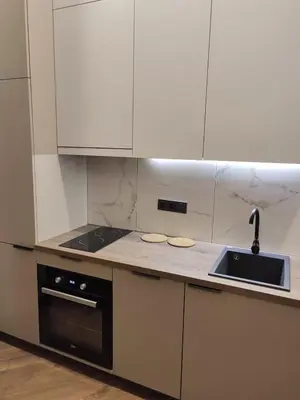 a kitchen with white cabinets and a sink at Stylish Central Station Old Town Apart FREE PARKING in Vilnius