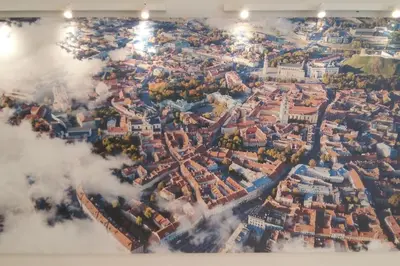 a picture of a city in the clouds at Studio Mindaugas in Vilnius