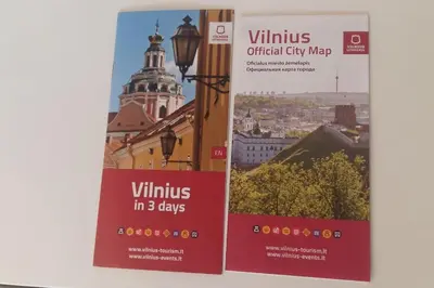two signs on a building with a view of a city at Studio Mindaugas in Vilnius