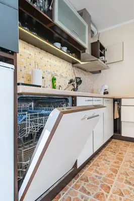 a kitchen with an dishwasher in a dish washer at Lovely city panorama apartment by Polo Apartments in Kaunas