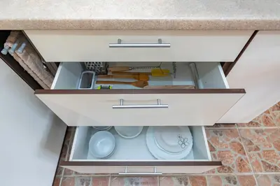 a drawer in a kitchen counter with a sink at Lovely city panorama apartment by Polo Apartments in Kaunas