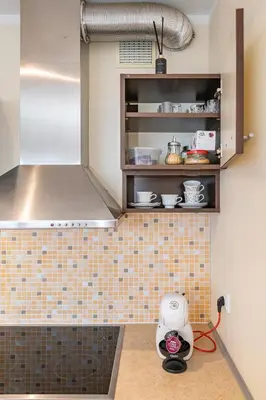 a kitchen with a scale on a tiled counter at Lovely city panorama apartment by Polo Apartments in Kaunas