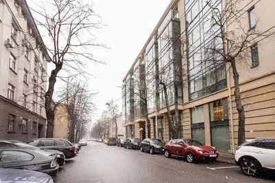 a street with cars parked on the side of a building at Business Apartment In Jaksto Street in Vilnius