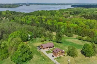 an overhead view of a large house in the woods at 3-bedroom villa surrounded by beautiful nature in Vaišvydava