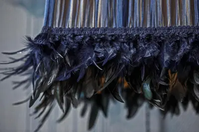 a bunch of feathers hanging on a wall at Luxuriuos flat in the capital's old town in Vilnius