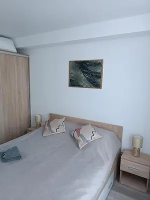 a bedroom with a bed with two pillows on it at Bruklinas in Šiauliai