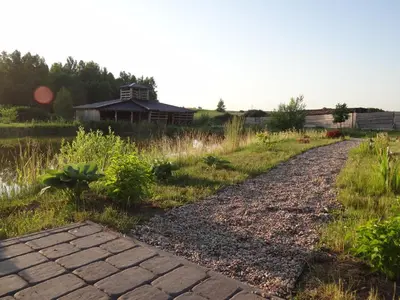 a brick path in front of a house at Sodyba PILIAKIEMIS in Kurkliškės