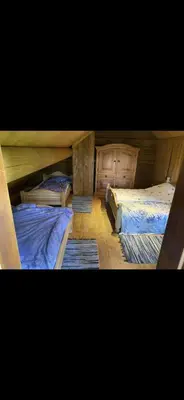 two bunk beds in a room with at Drulenu sodyba in Drūlėnai