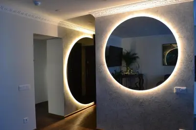a room with two circular mirrors on a wall at E. D. Elite Apartment in Šiauliai