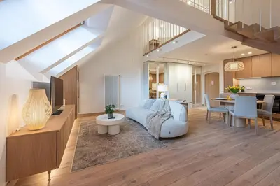 a living room with a couch and a table at cohost I Premium Residence I on the Historic Pilies Street I Self Check-in in Vilnius