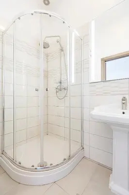 a bathroom with a shower and a sink at Central Stylish Well Equiped Apartments - Self Check-in in Vilnius