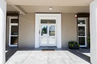an entrance to a building with a white door at Central Stylish Well Equiped Apartments - Self Check-in in Vilnius