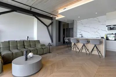 a living room with a couch and a table at HOUSE38 Panoramic View Apartments SELF CHECK-IN in Kaunas