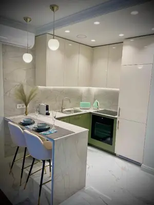 a kitchen with a table and chairs and a sink at New luxury apartment & free parking in Vilnius