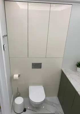a small bathroom with a toilet and a sink at New luxury apartment & free parking in Vilnius