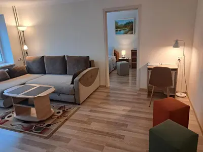 a living room with a couch and a table at Sweet home in Šiauliai