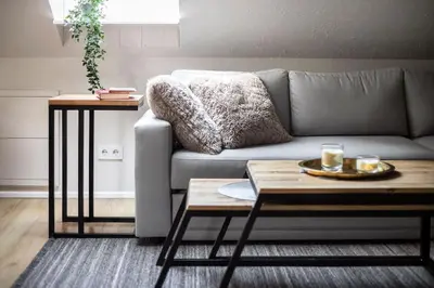 a living room with a couch and a coffee table at Luxury apartment in Gediminas avenue with terrace in Vilnius