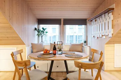 a dining room with a table and two chairs at Luxury apartment in Gedimino av. in Vilnius